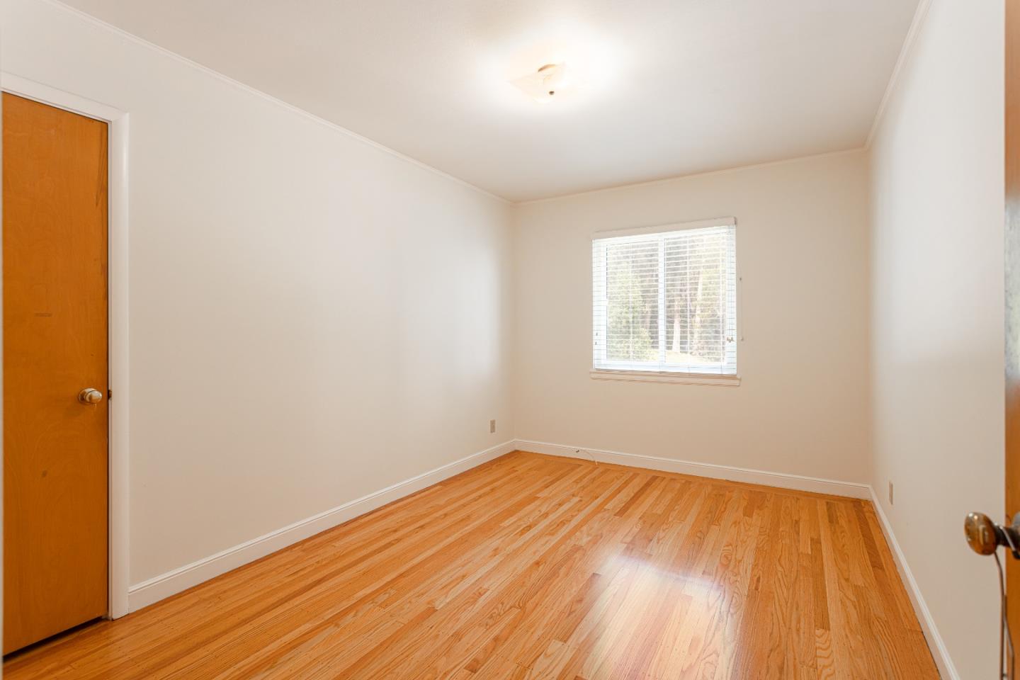20 Fairview Place Millbrae, CA 94030 - Photo 16 of 21 an empty room with wooden floor and windows