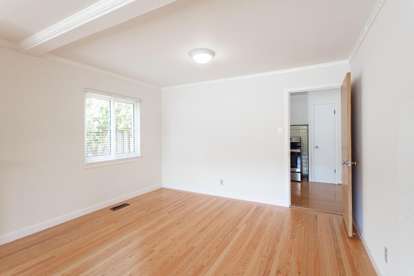 20 Fairview Place Millbrae, CA 94030 - Photo 8 of 21 an empty room with wooden floor and windows
