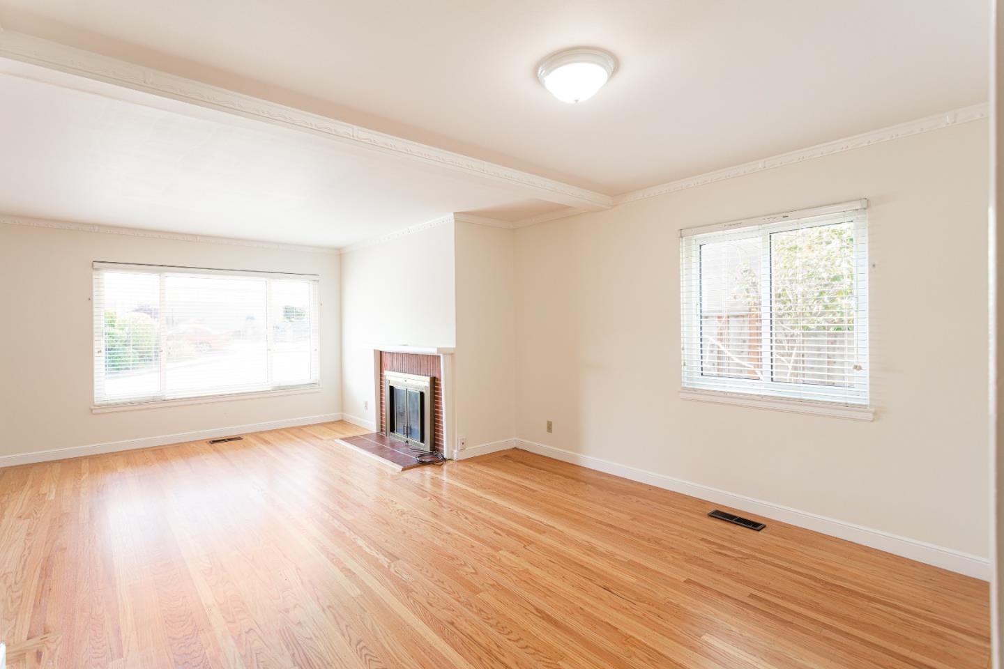 20 Fairview Place Millbrae, CA 94030 - Photo 9 of 21 an empty room with wooden floor and windows
