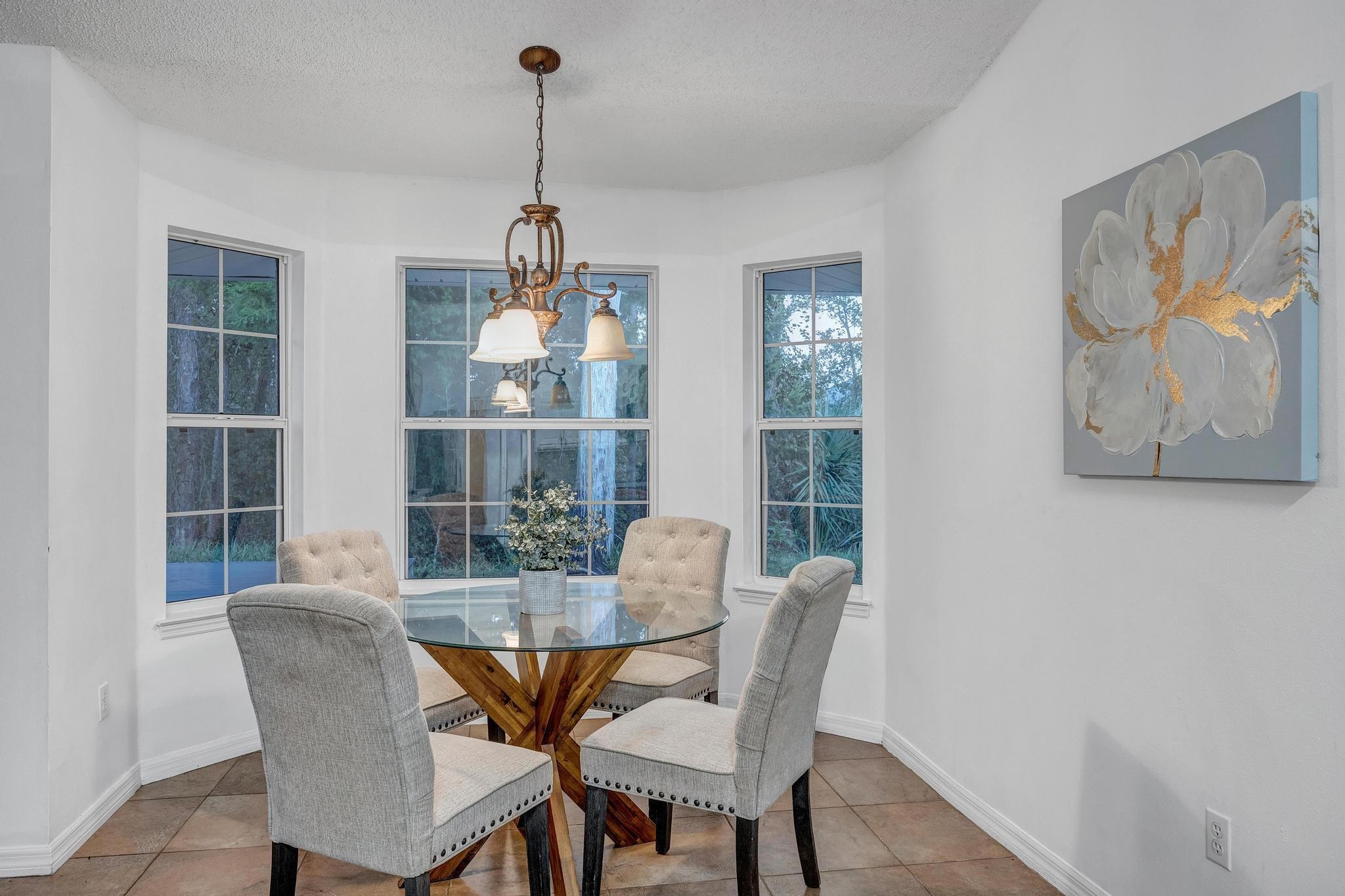 98 Roxboro Drive Palm Coast, FL 32164 - Photo 12 of 28 a dining room with furniture and window