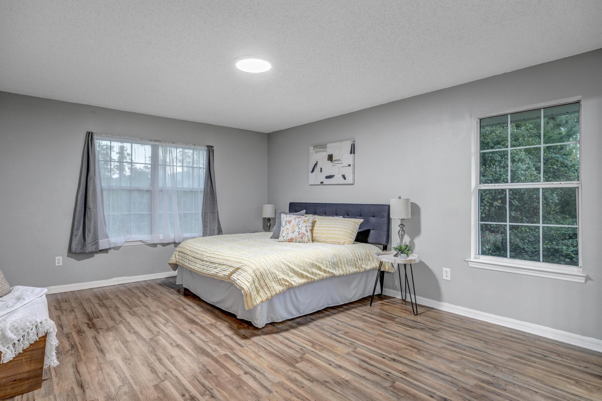 98 Roxboro Drive Palm Coast, FL 32164 - Photo 16 of 28 a bedroom with a bed and a window