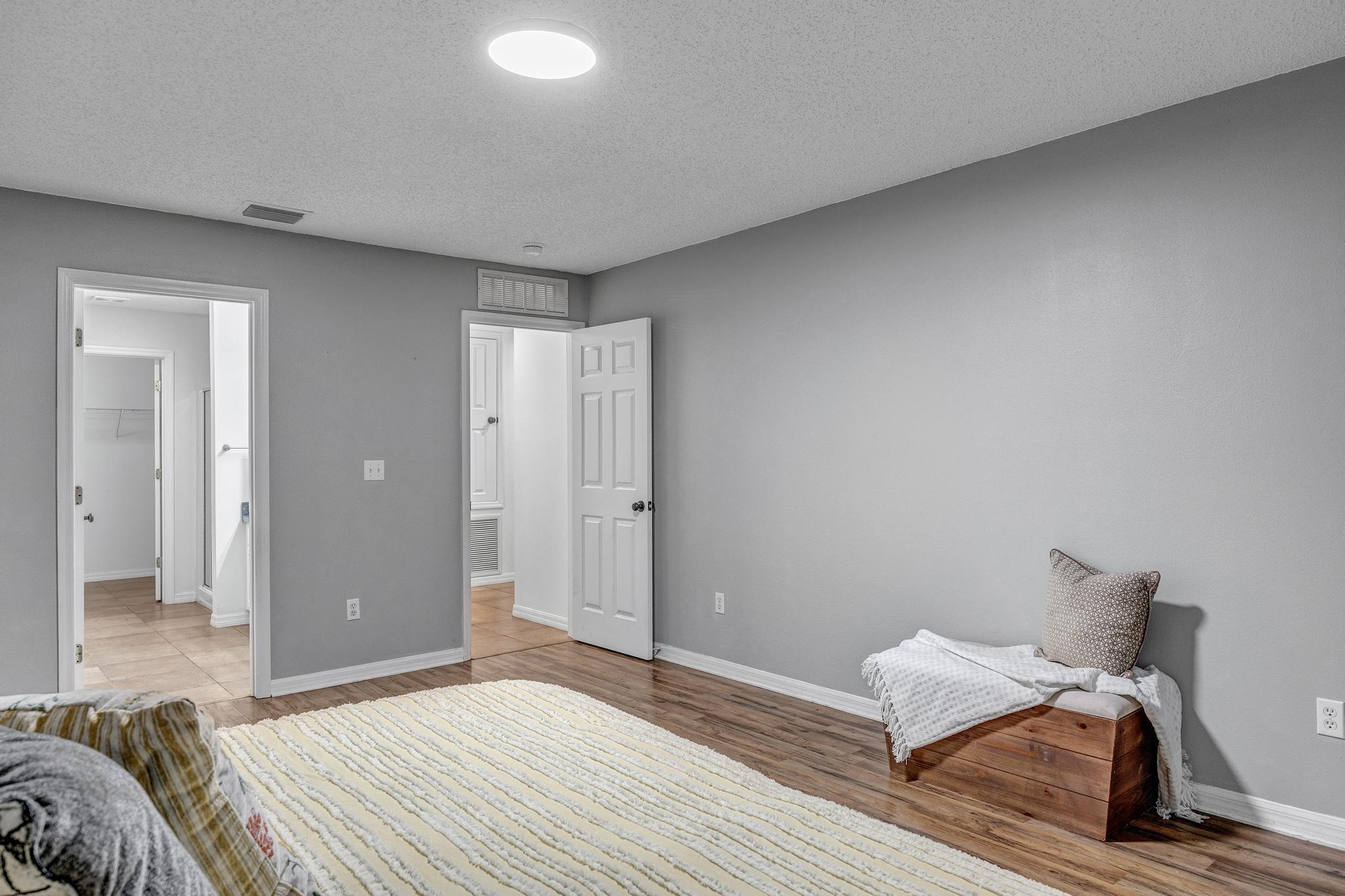 98 Roxboro Drive Palm Coast, FL 32164 - Photo 18 of 28 a bed room with a bed and a window