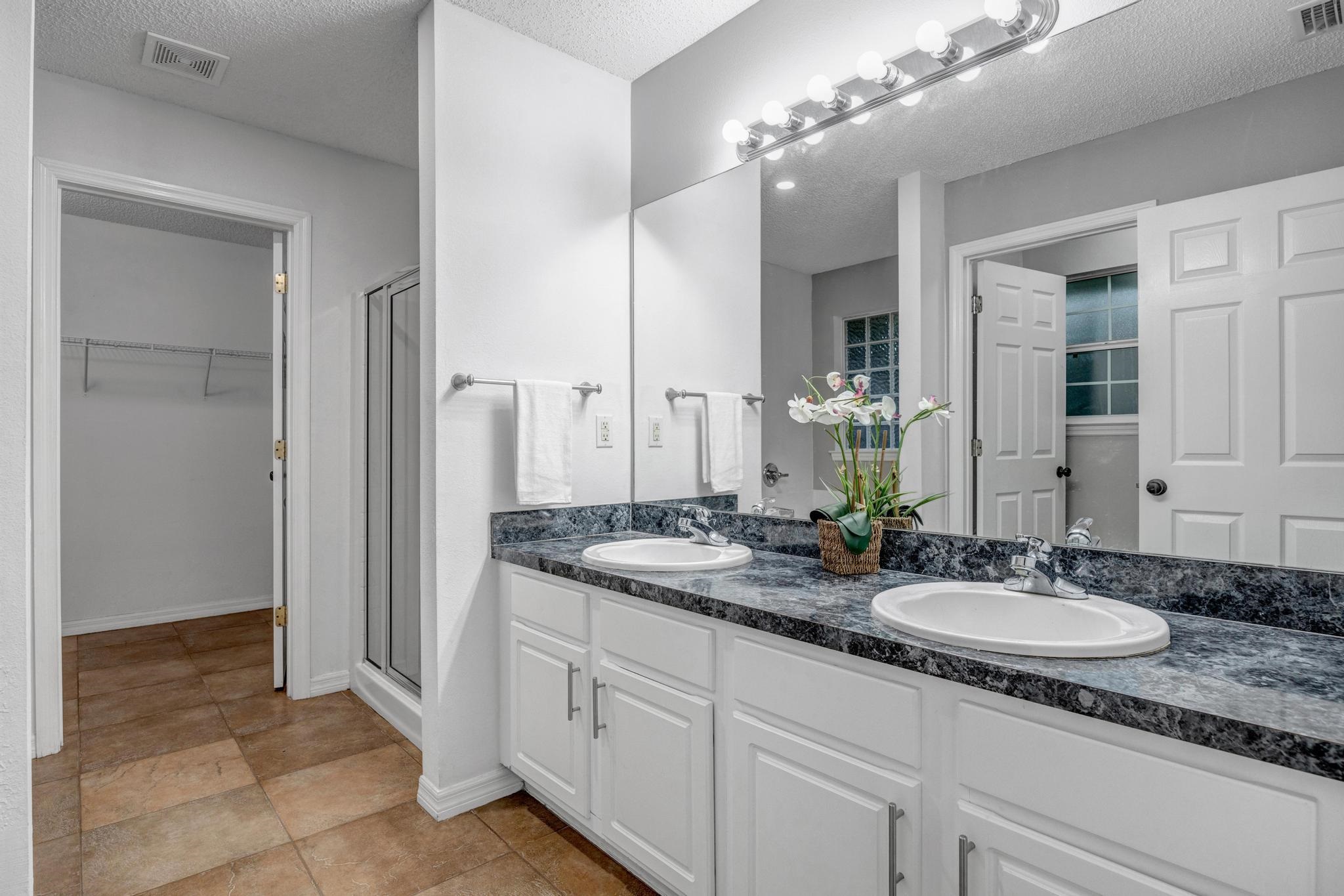 98 Roxboro Drive Palm Coast, FL 32164 - Photo 19 of 28 a bathroom with a sink and a mirror