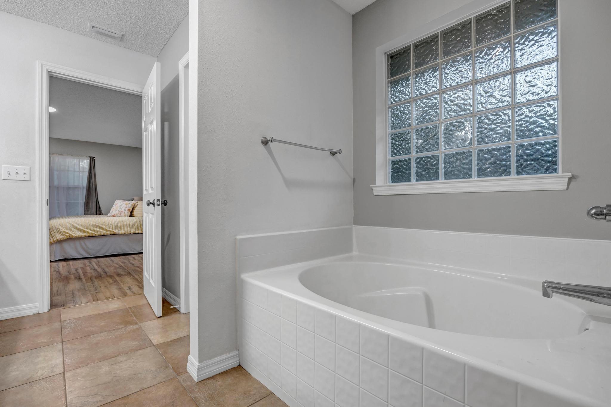 98 Roxboro Drive Palm Coast, FL 32164 - Photo 20 of 28 a white bath tub sitting next to a bathroom sink