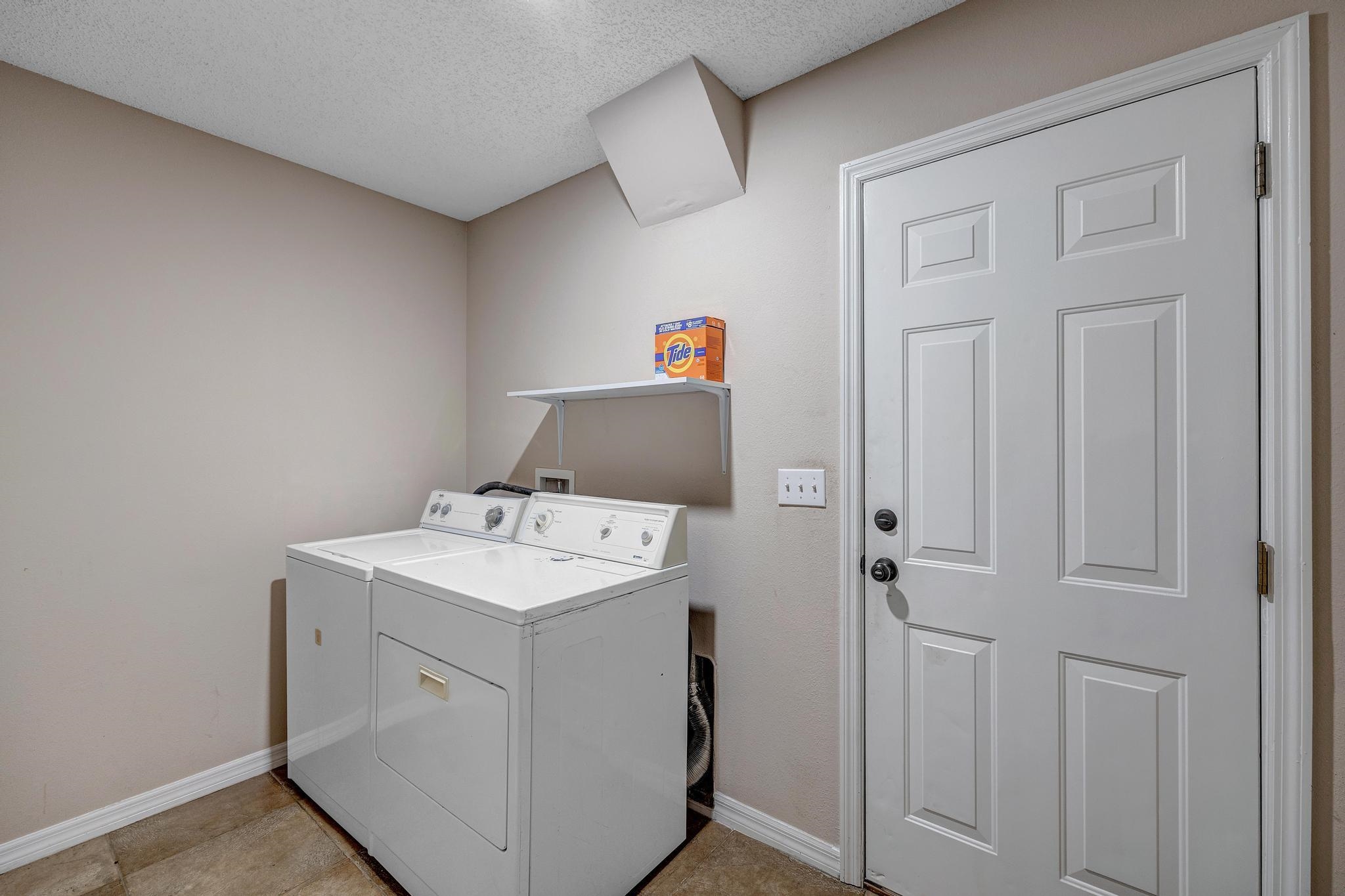 98 Roxboro Drive Palm Coast, FL 32164 - Photo 27 of 28 a utility room with dryer and washer