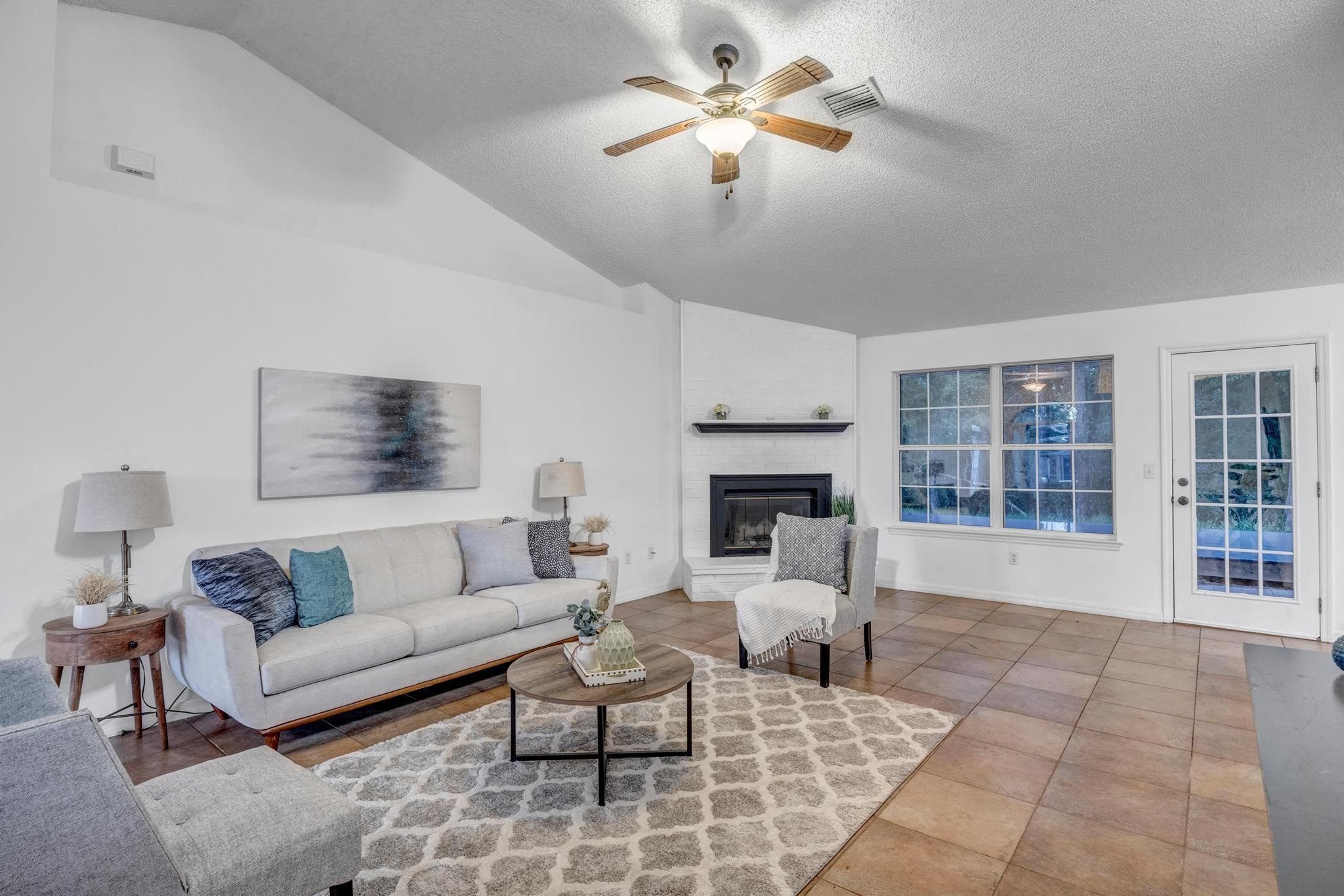98 Roxboro Drive Palm Coast, FL 32164 - Photo 8 of 28 a living room with furniture and a fireplace