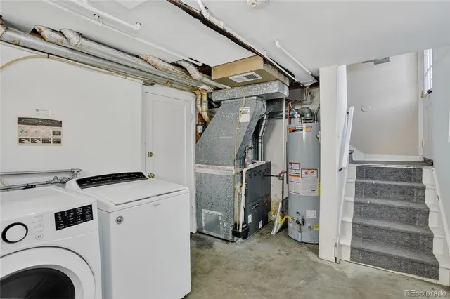 a view of storage and utility room with washer and dryer