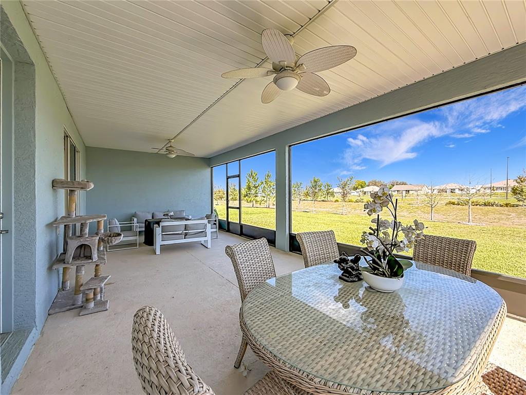 7429 Southwest 61st Street Ocala, FL 34474 - Photo 18 of 40 a living room with furniture and a large window
