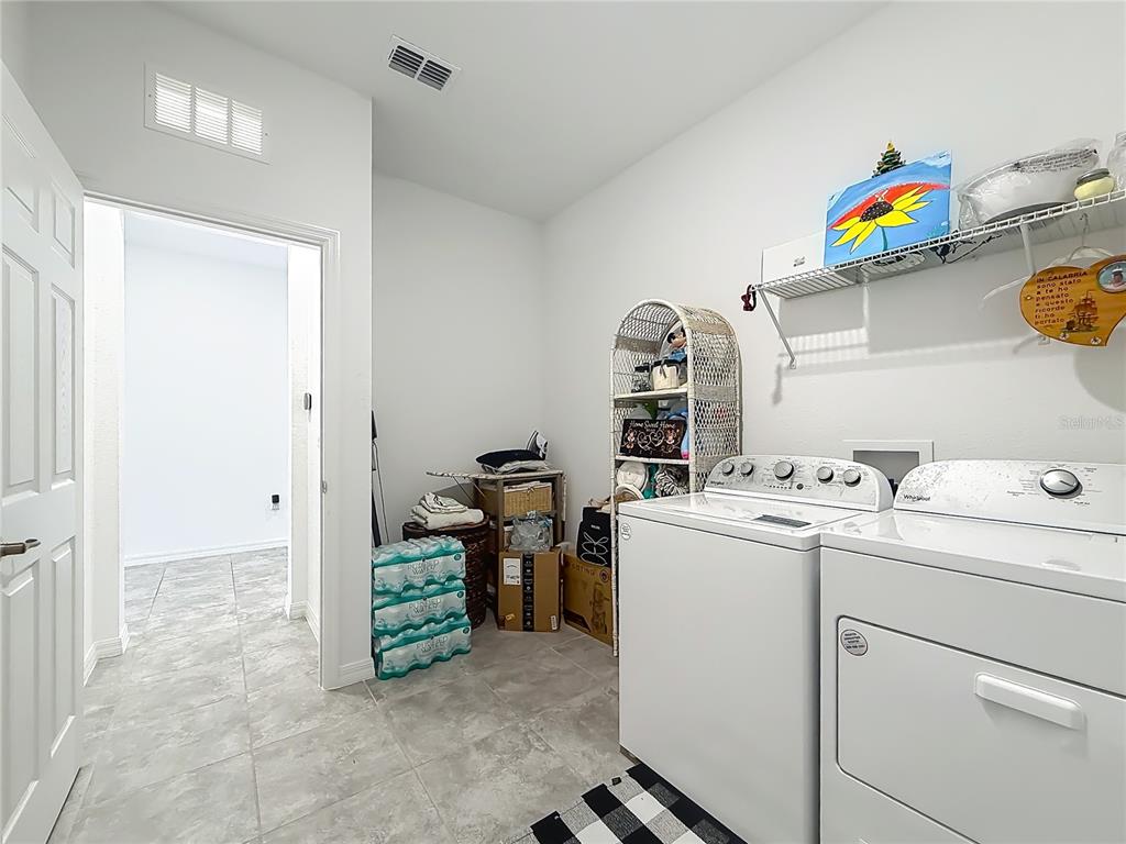 7429 Southwest 61st Street Ocala, FL 34474 - Photo 23 of 40 a utility room with dryer and washer