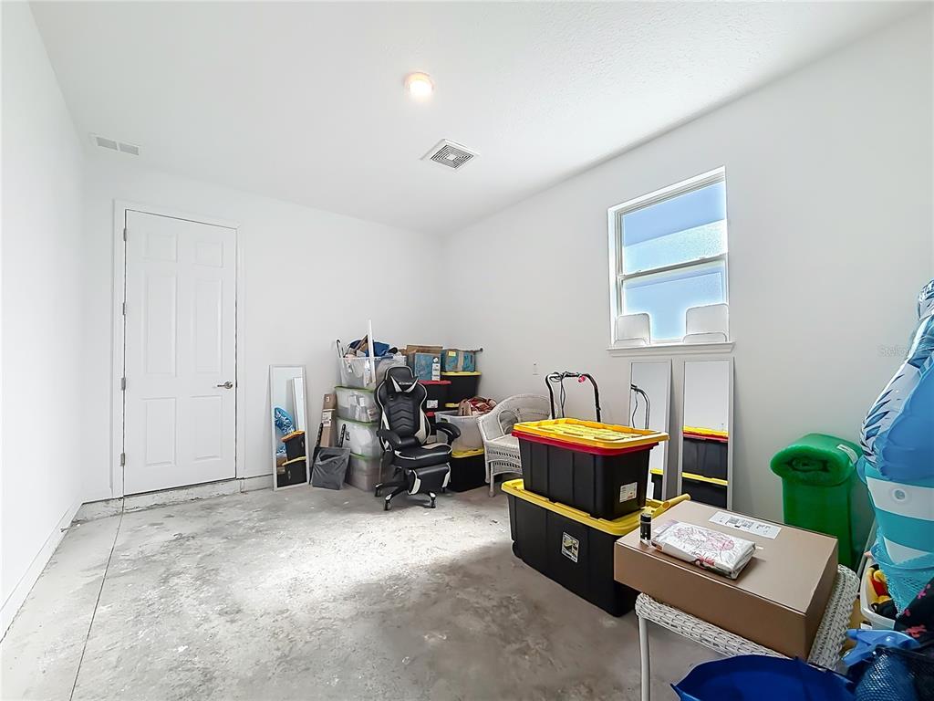 7429 Southwest 61st Street Ocala, FL 34474 - Photo 25 of 40 a room with furniture and air hockey table