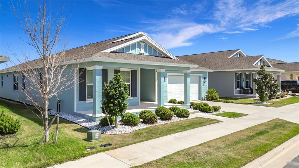 7429 Southwest 61st Street Ocala, FL 34474 - Photo 35 of 40 a front view of a house with garden