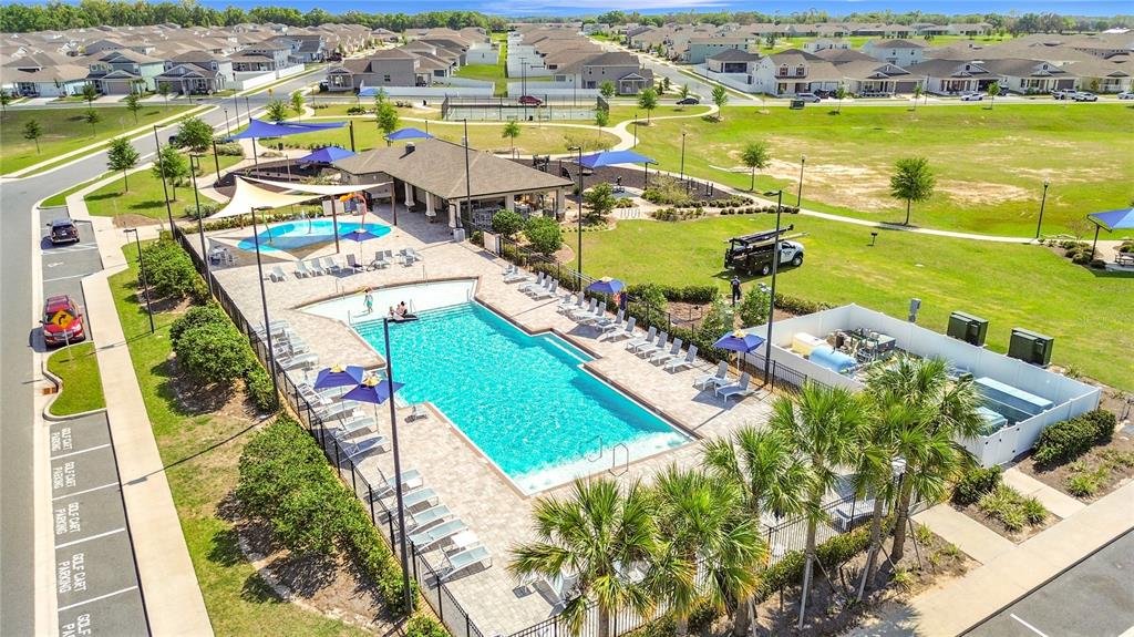 7429 Southwest 61st Street Ocala, FL 34474 - Photo 39 of 40 an aerial view of residential houses with outdoor space and swimming pool