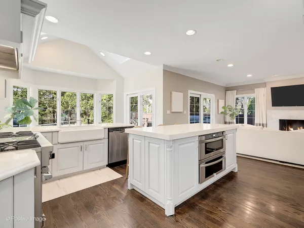 a kitchen with stove and sink