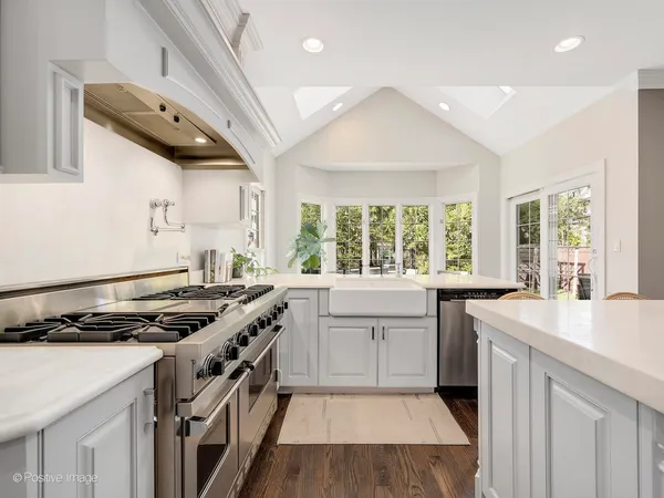 a kitchen that has a sink and a stove