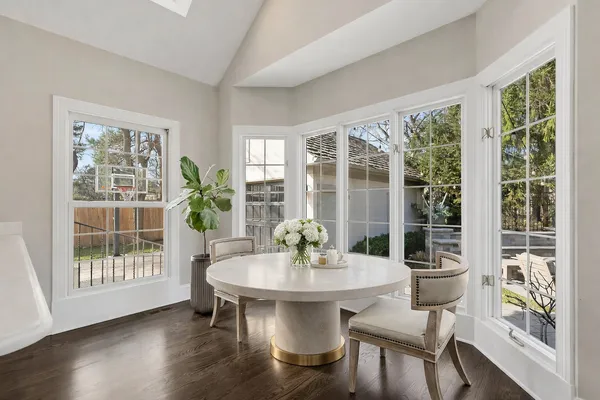 a dining room with furniture window wooden floor