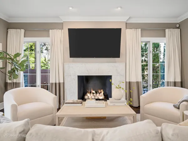a view of a livingroom with furniture and a fireplace