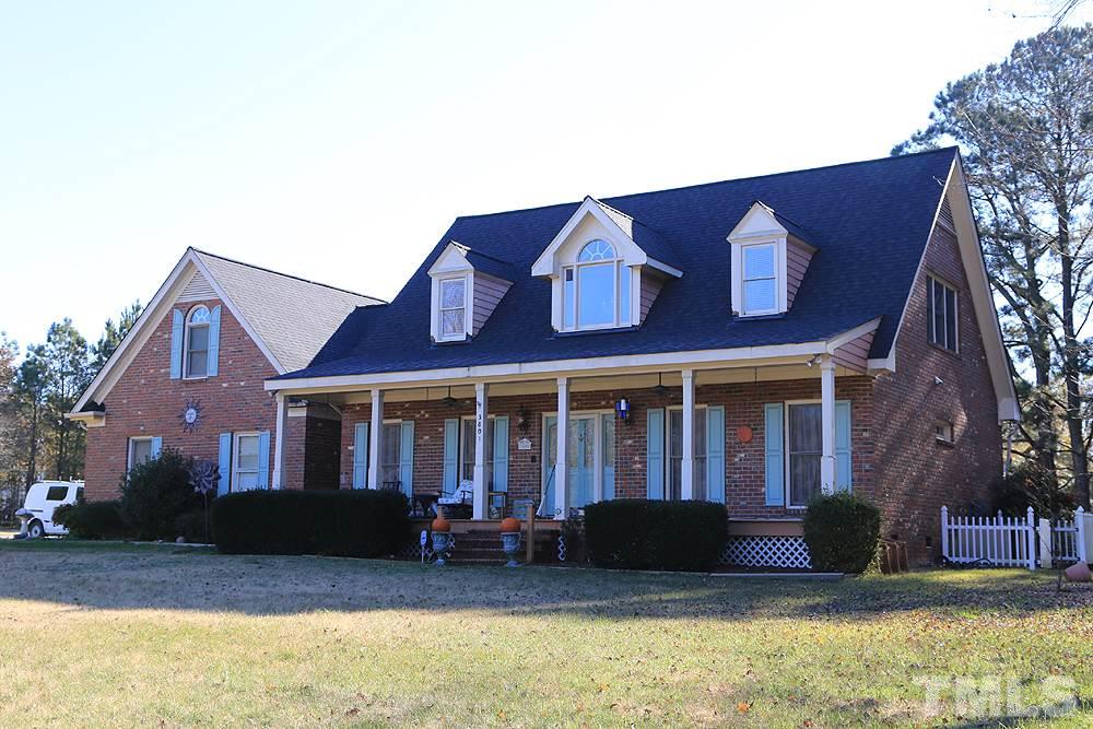 3801 Pearl Road Raleigh, NC 27610 - Photo 1 of 13 a front view of a house with a yard
