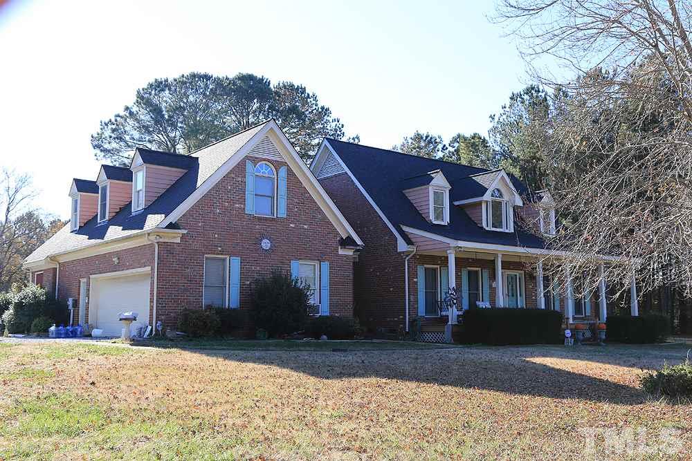 3801 Pearl Road Raleigh, NC 27610 - Photo 2 of 13 a front view of a house with a yard