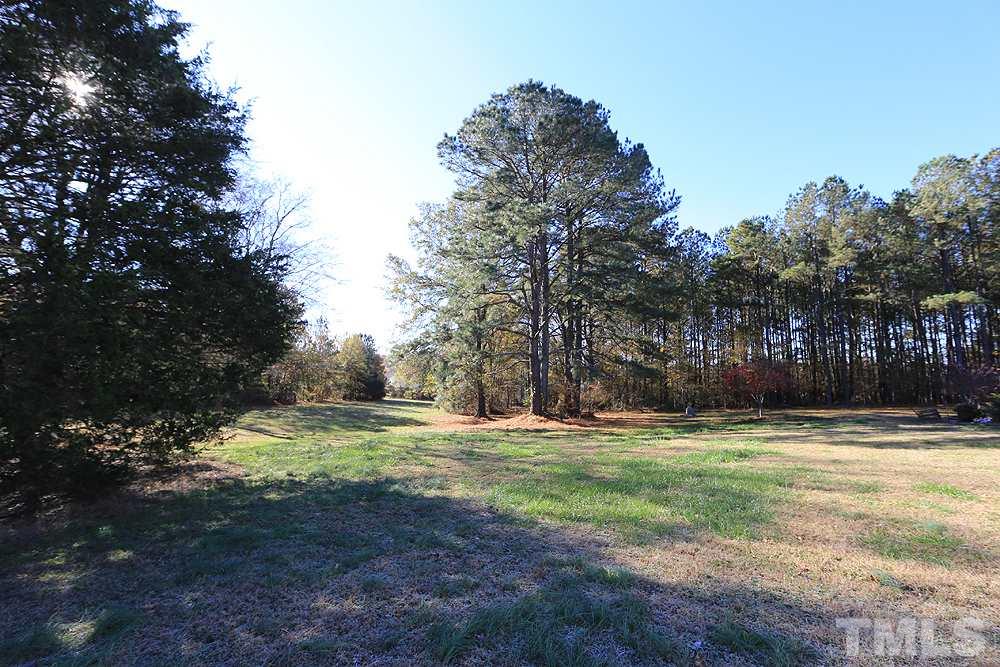 3801 Pearl Road Raleigh, NC 27610 - Photo 5 of 13 a view of a yard with large trees