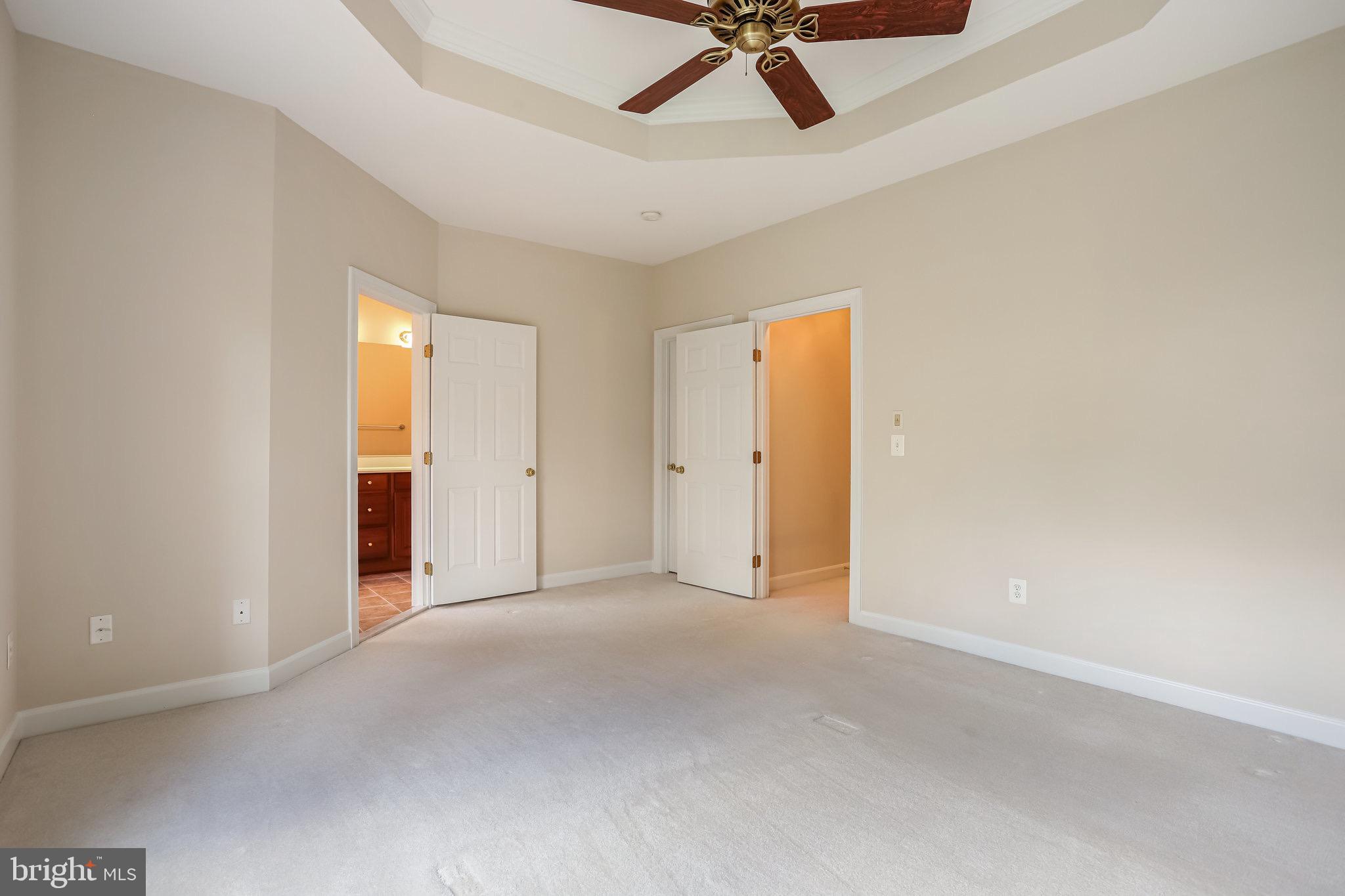 18546 Perdido Bay Terrace Leesburg, VA 20176 - Photo 19 of 57 an empty room with a ceiling fan and window
