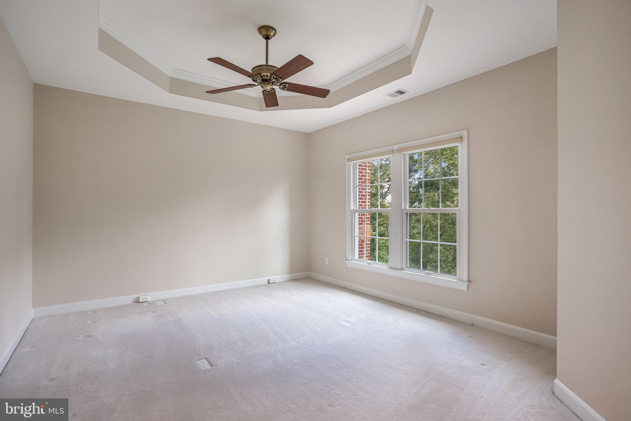 18546 Perdido Bay Terrace Leesburg, VA 20176 - Photo 20 of 57 an empty room with a window and a fan