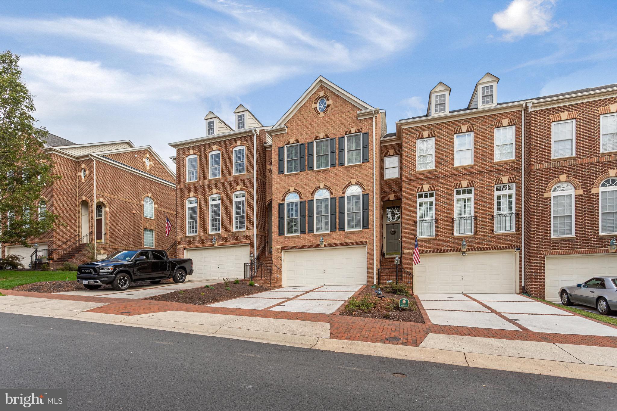 18546 Perdido Bay Terrace Leesburg, VA 20176 - Photo 2 of 57 a front view of a building with street view