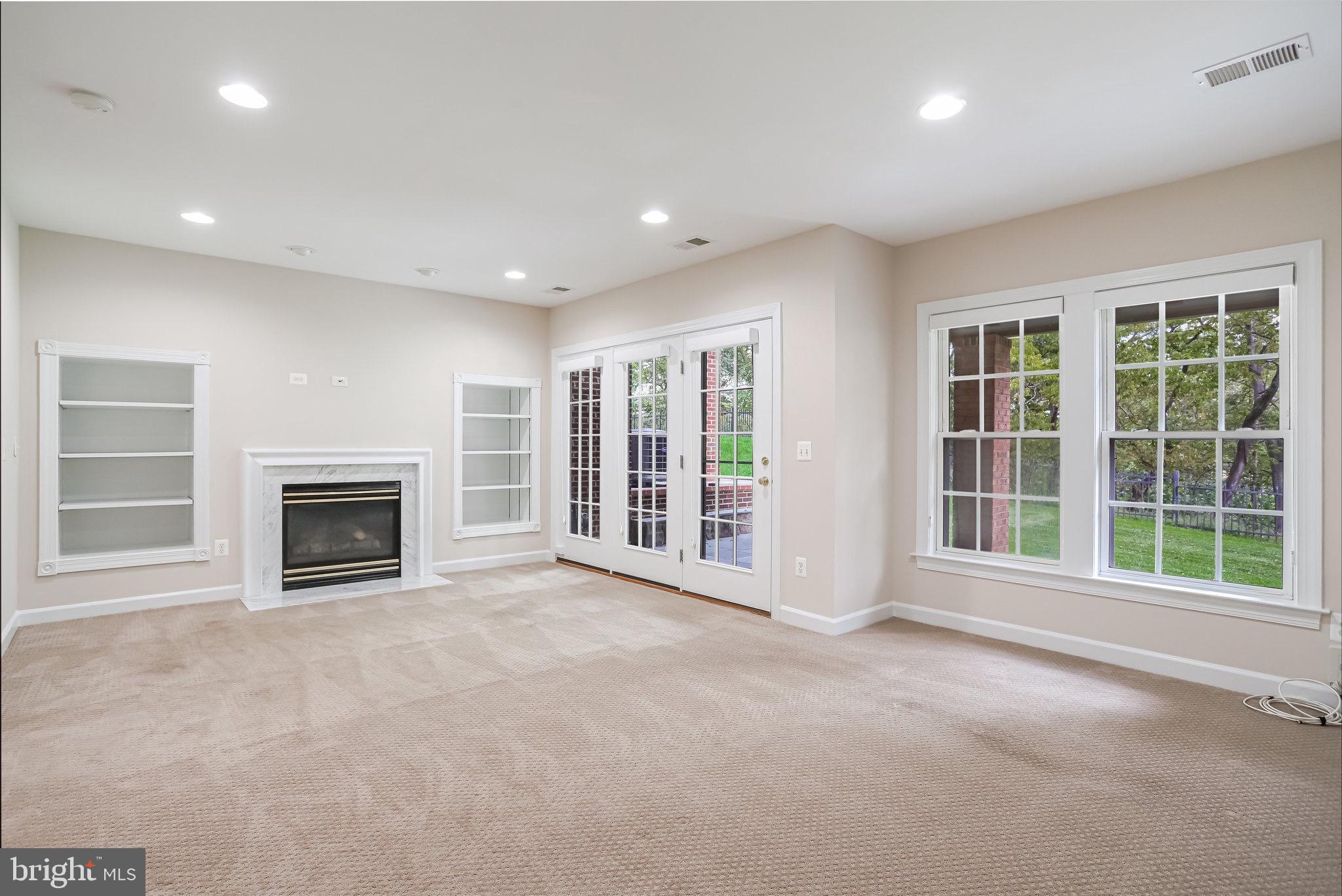 18546 Perdido Bay Terrace Leesburg, VA 20176 - Photo 35 of 57 a view of an empty room with a fireplace and a window