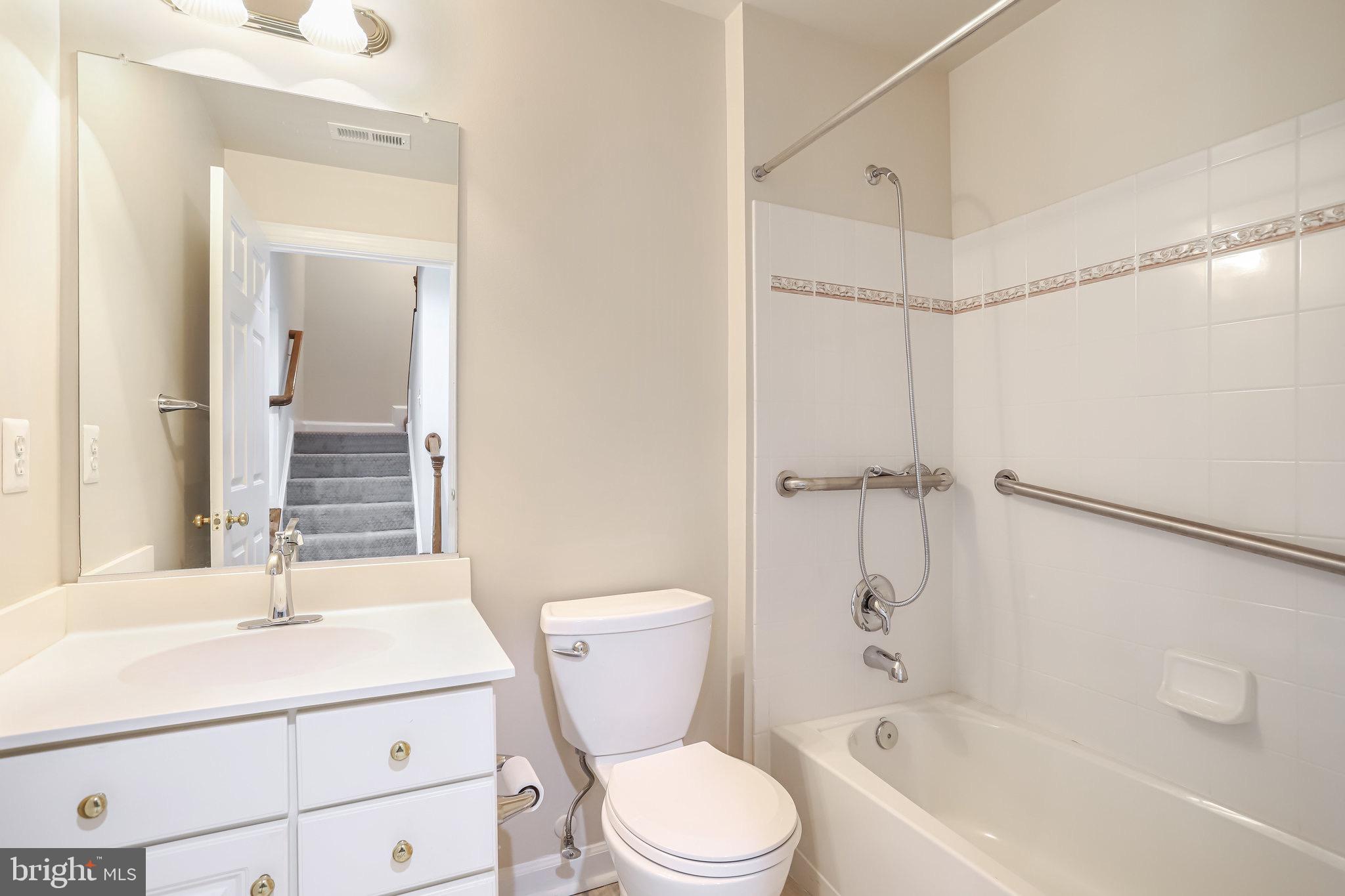 18546 Perdido Bay Terrace Leesburg, VA 20176 - Photo 36 of 57 a bathroom with a sink toilet and shower