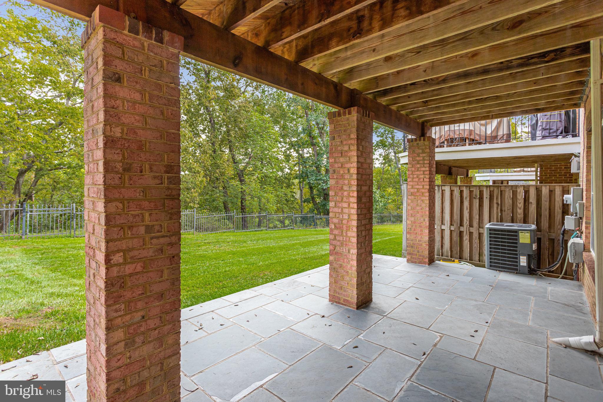 18546 Perdido Bay Terrace Leesburg, VA 20176 - Photo 40 of 57 a view of a porch with a garden