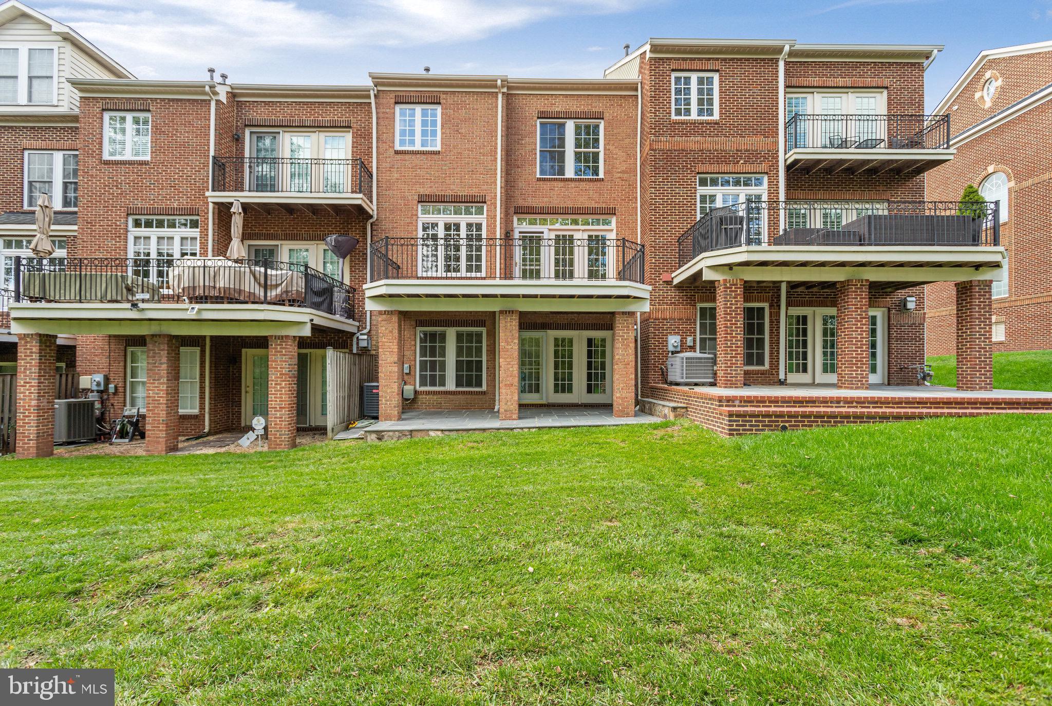 18546 Perdido Bay Terrace Leesburg, VA 20176 - Photo 43 of 57 a view of a building with a yard