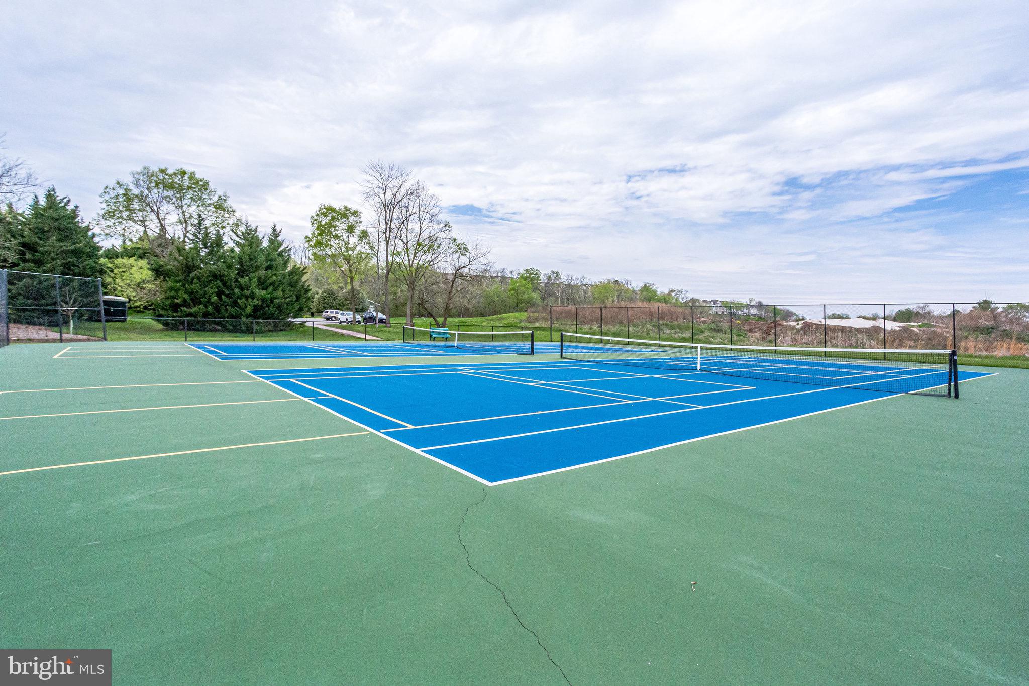 18546 Perdido Bay Terrace Leesburg, VA 20176 - Photo 56 of 57 a view of an outdoor space and tennis court