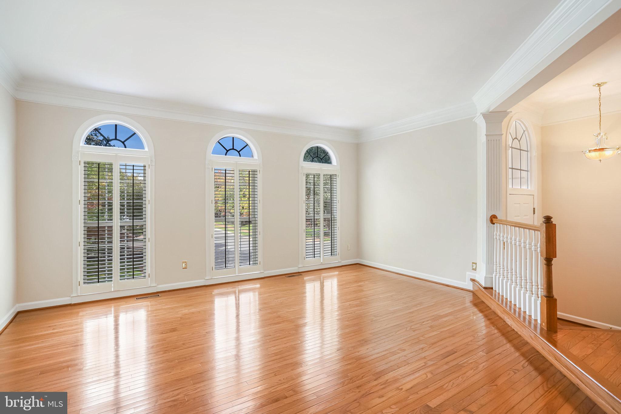 18546 Perdido Bay Terrace Leesburg, VA 20176 - Photo 7 of 57 a view of a room with wooden floor and windows