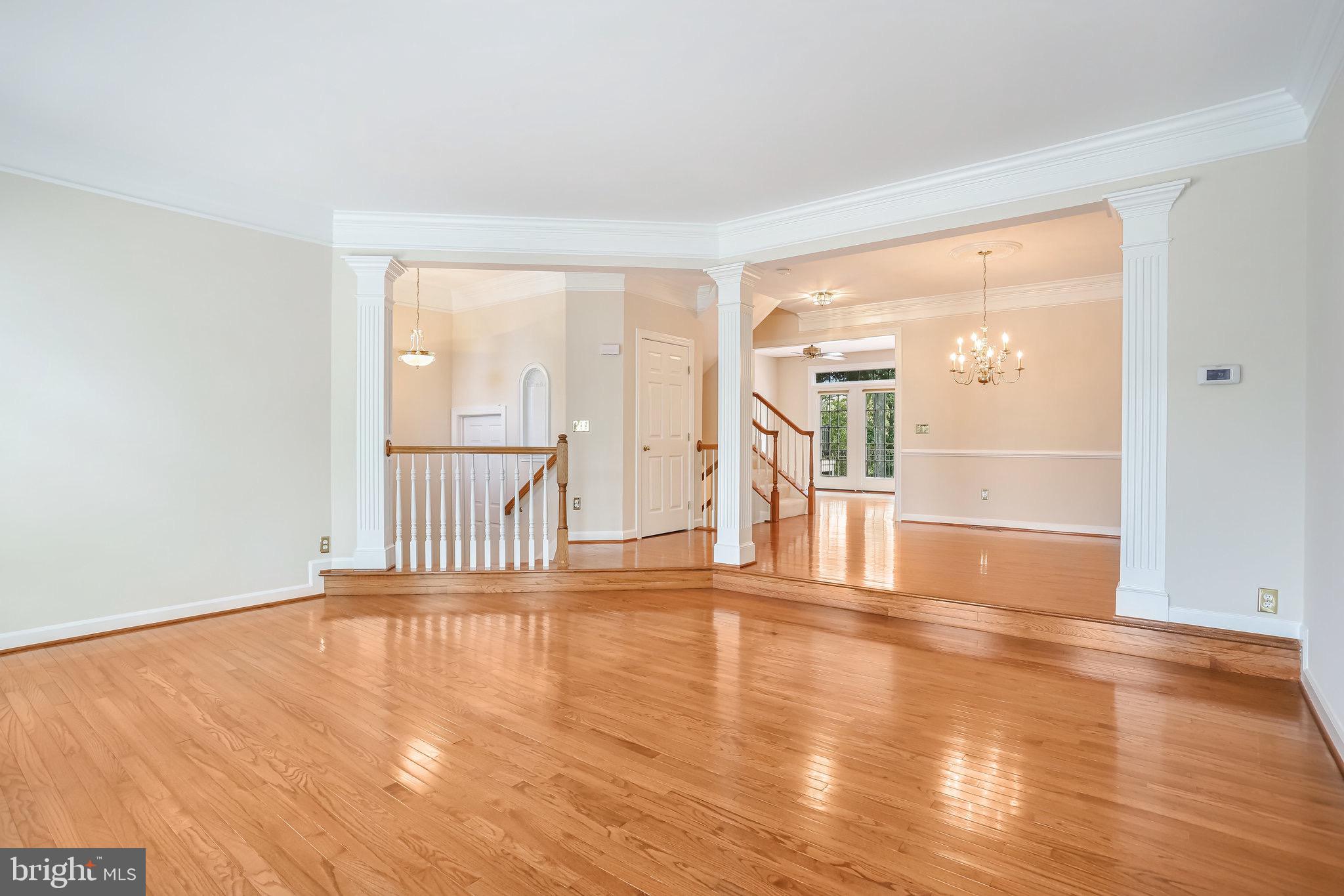 18546 Perdido Bay Terrace Leesburg, VA 20176 - Photo 8 of 57 a view of an empty room with wooden floor
