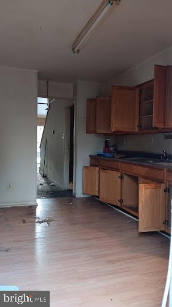 3557 North Marshall Street Philadelphia, PA 19140 - Photo 3 of 9 a kitchen with granite countertop a stove and a wooden floors
