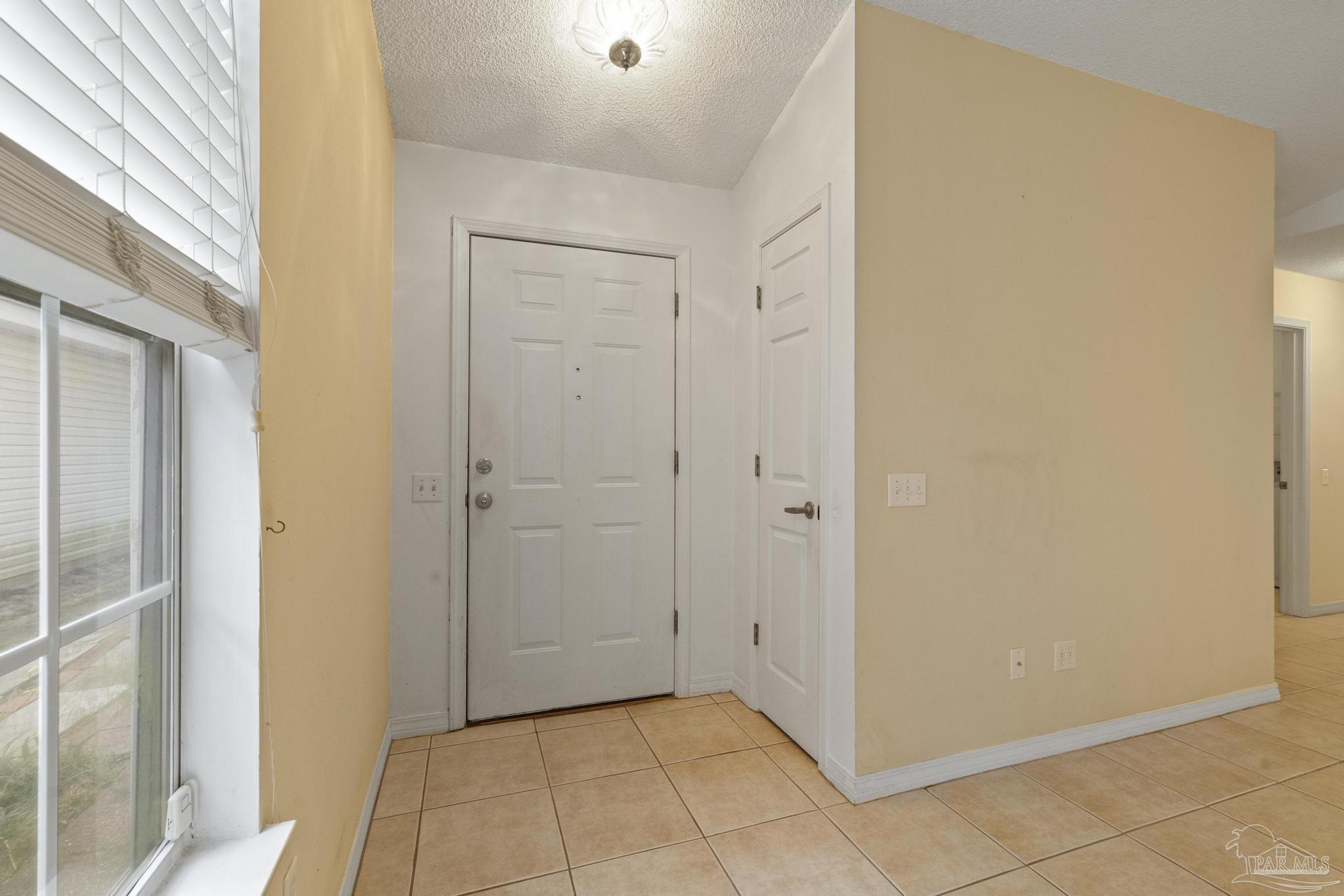 1342 Sunrunner Road Pensacola, FL 32504 - Photo 4 of 34 tile floors in foyer and great room