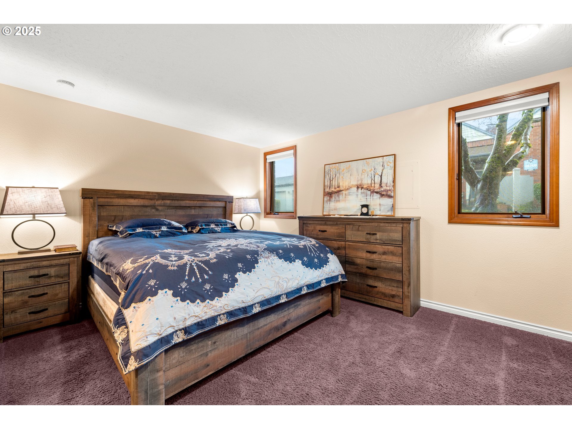14945 Northeast Sacramento Street, Unit 34 Portland, OR 97230 - Photo 13 of 26 a bedroom with a bed and dresser