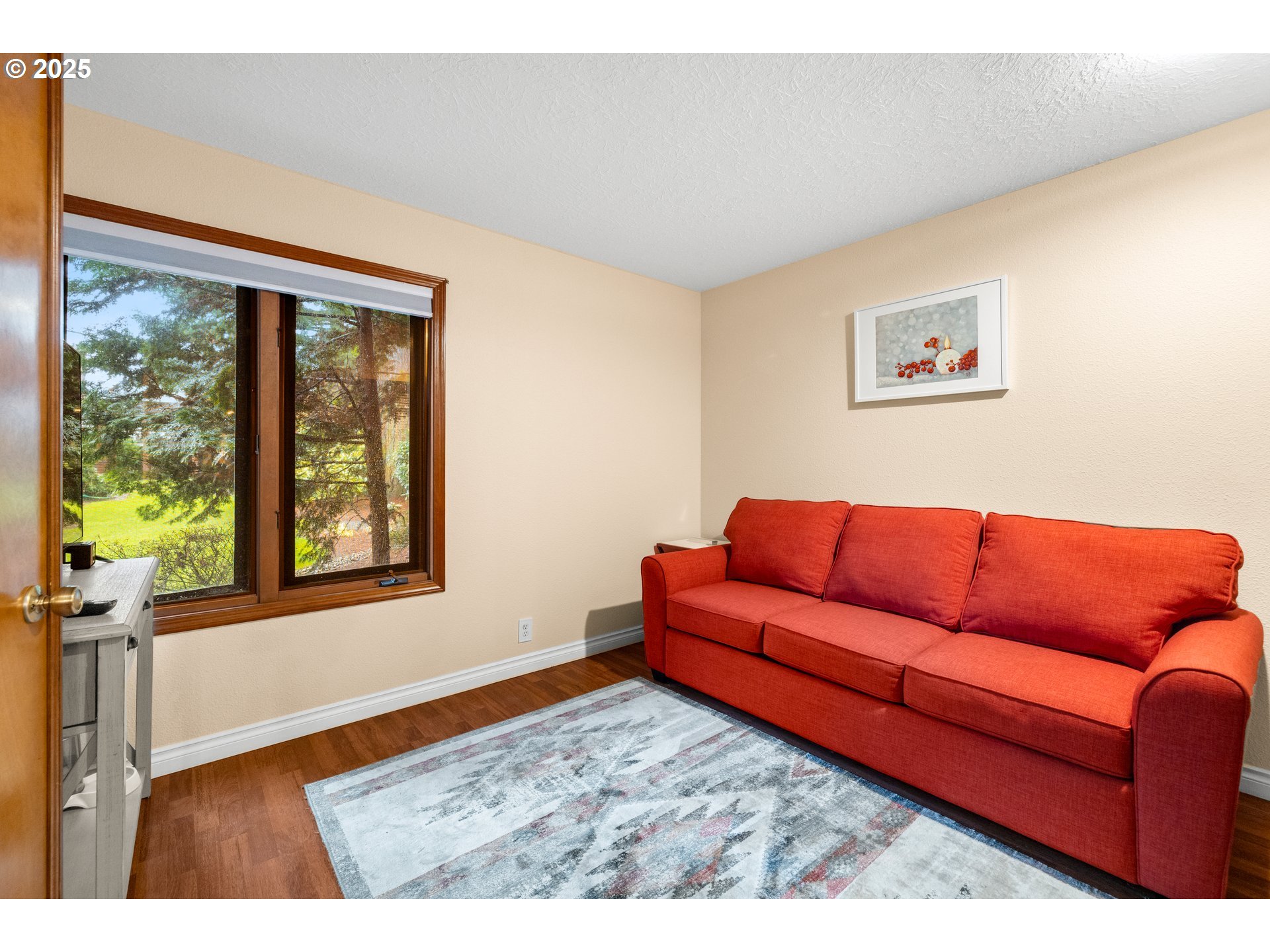14945 Northeast Sacramento Street, Unit 34 Portland, OR 97230 - Photo 16 of 26 a living room with furniture and a window