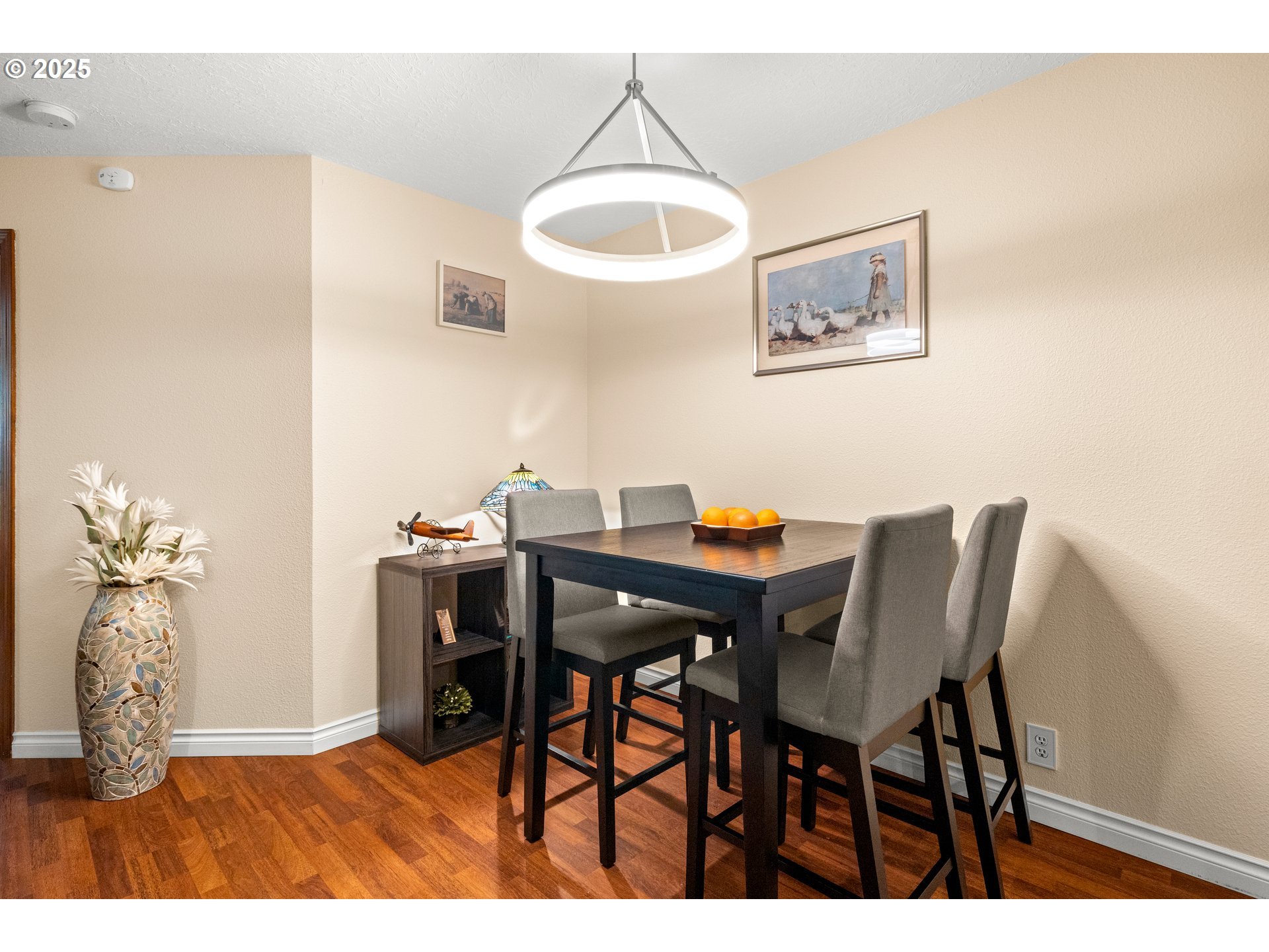 14945 Northeast Sacramento Street, Unit 34 Portland, OR 97230 - Photo 8 of 26 a view of a dining room with furniture and chandelier