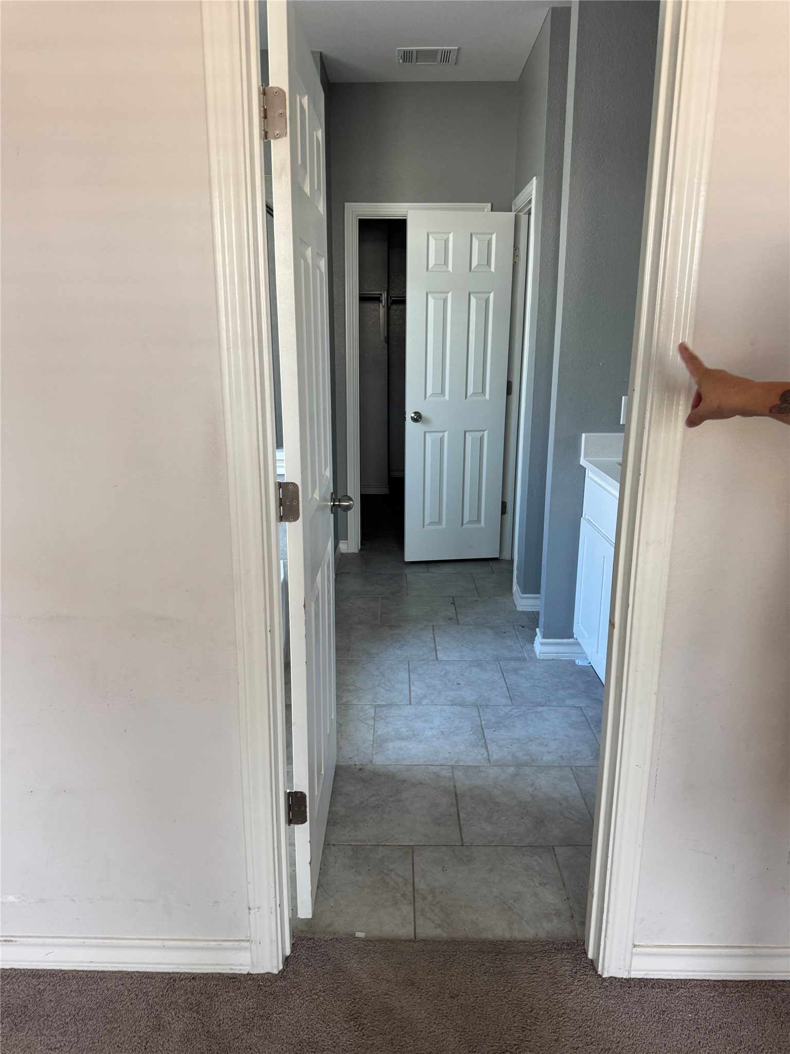 333 Capstone Road Liberty Hill, TX 78642 - Photo 21 of 40 Hall with baseboards and light carpet