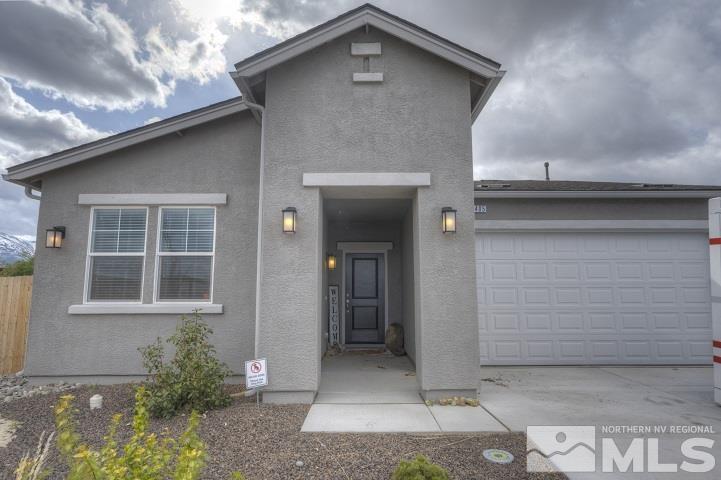 9405 Cape Drive Reno, NV 89506 - Photo 1 of 17 a front view of a house with a yard