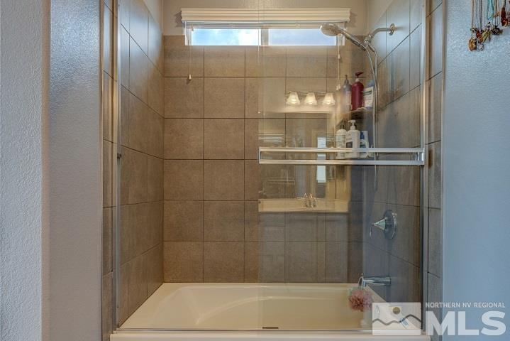 9405 Cape Drive Reno, NV 89506 - Photo 13 of 17 a bathroom with a bathtub
