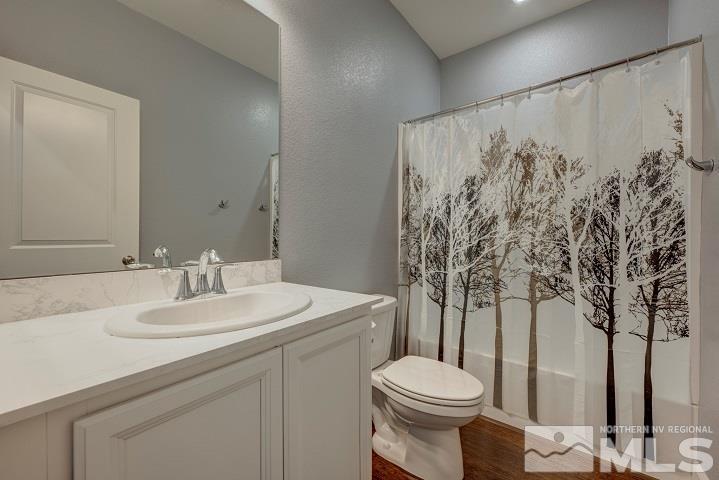 9405 Cape Drive Reno, NV 89506 - Photo 14 of 17 a bathroom with a sink toilet and shower