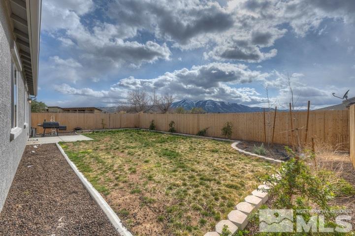 9405 Cape Drive Reno, NV 89506 - Photo 16 of 17 a view of backyard with wooden fence