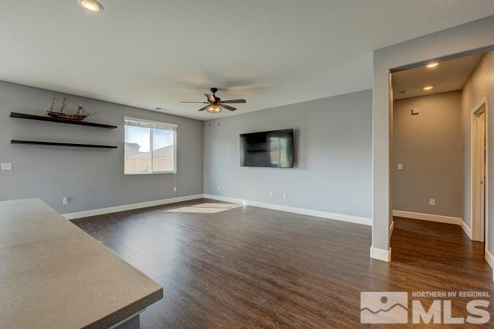9405 Cape Drive Reno, NV 89506 - Photo 8 of 17 a view of an empty room with wooden floor and a window