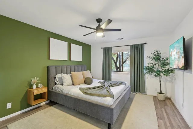 a bedroom with a bed and a table