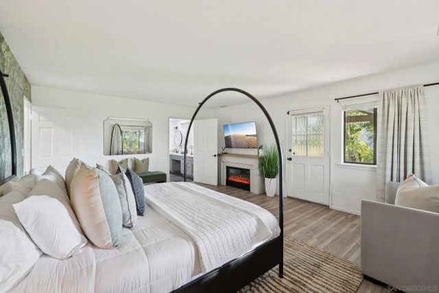 a view of a house with a yard street and a forest