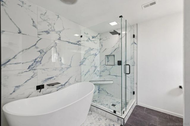 a kitchen with stainless steel appliances granite countertop a sink dishwasher and a wooden cabinets