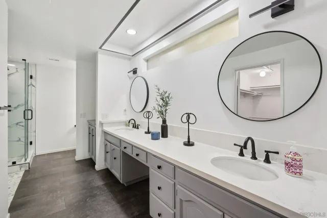 a kitchen with stainless steel appliances granite countertop a sink dishwasher and a wooden cabinets