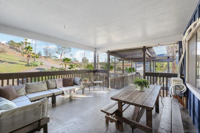 a bedroom with a large bed and a potted plant