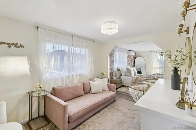 a view of a lake with a table and chairs under an umbrella